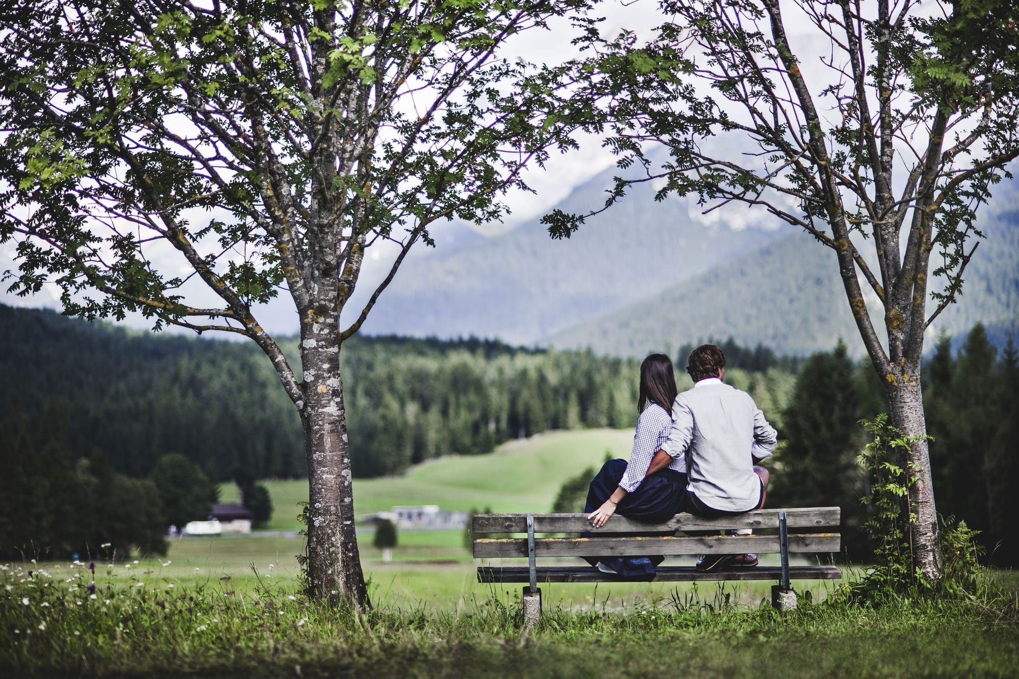 A hiker looking out over the high plateau of the Seefeld region